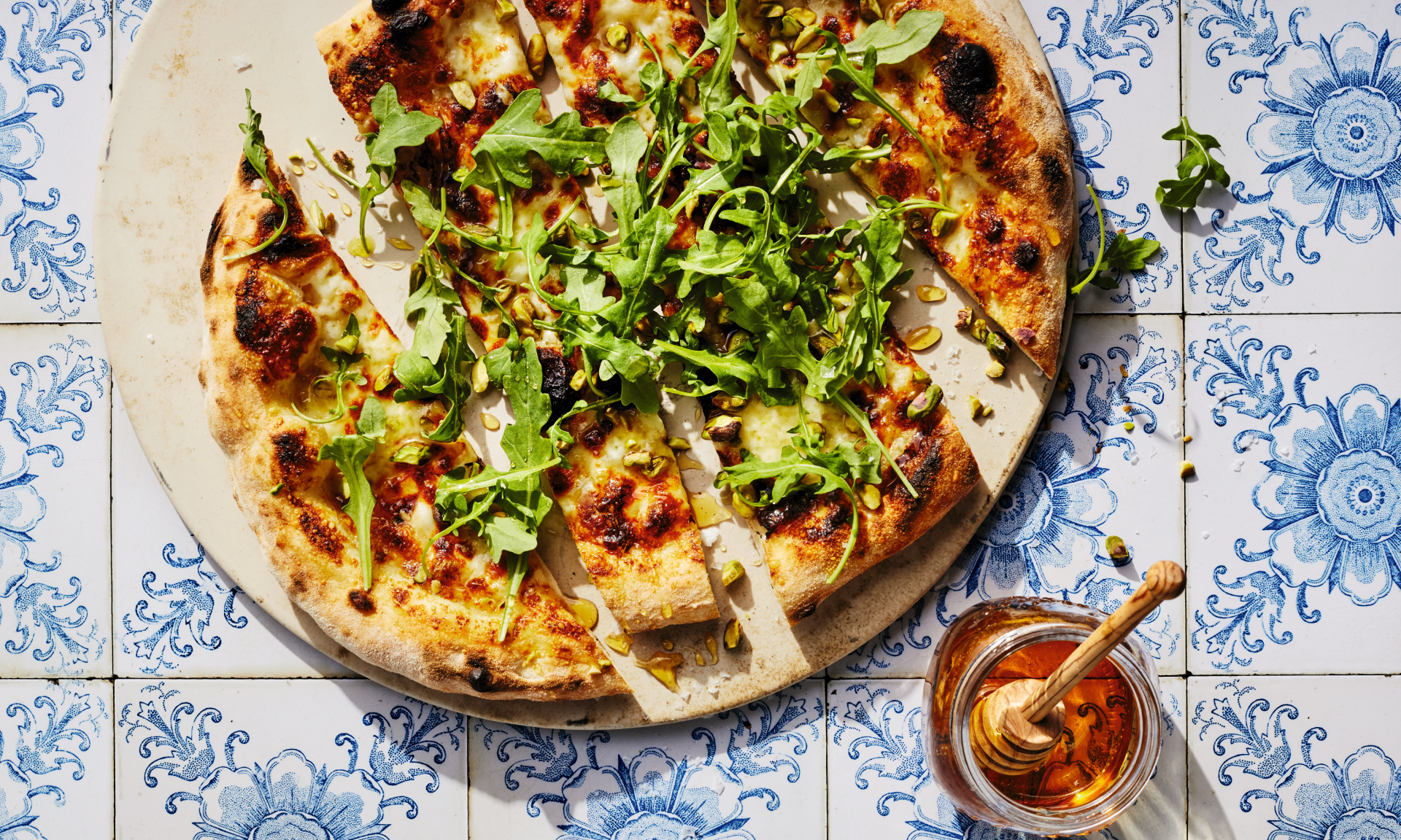 White Pizza with Arugula, Pistachios, and Honey