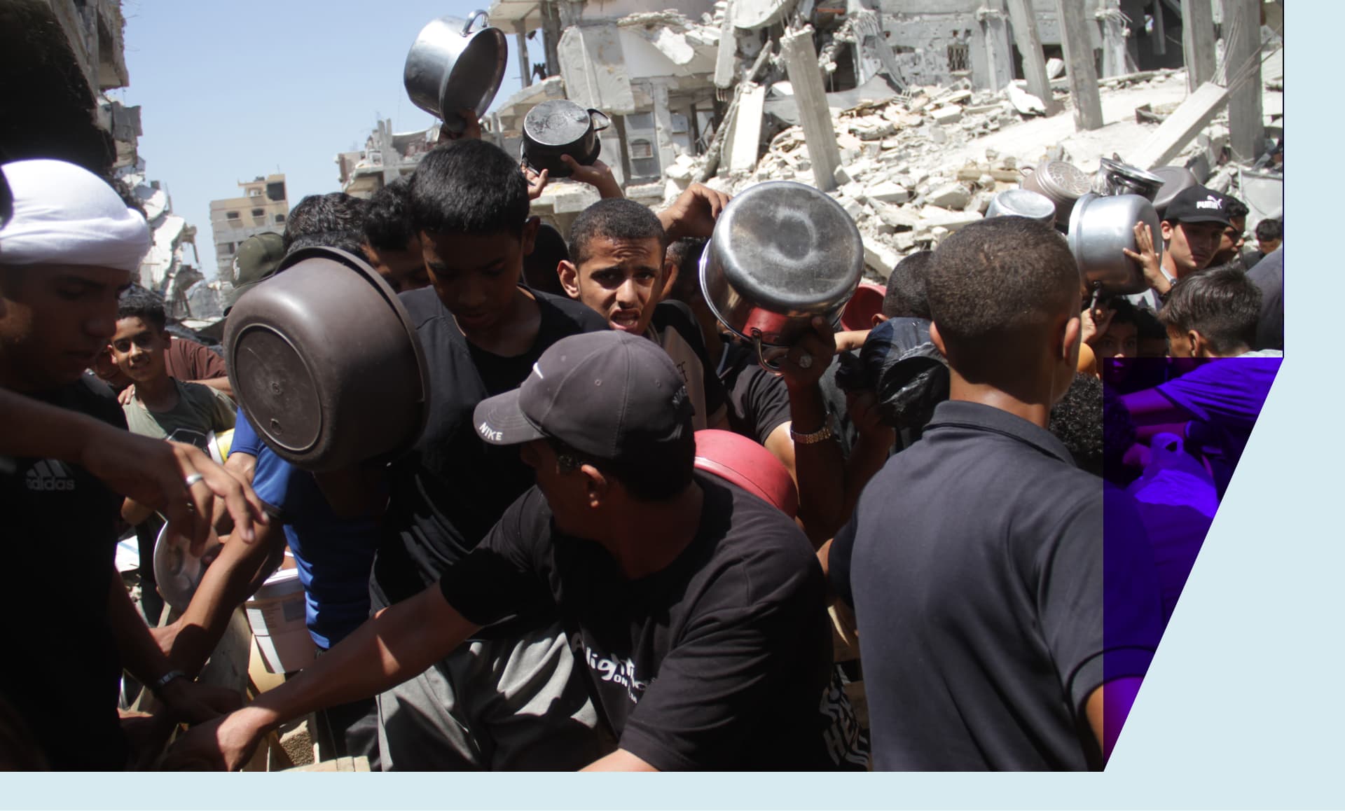 People gather to receive food relief in the Jabalia refugee camp in the northern Gaza Strip, on Aug. 26, 2024.