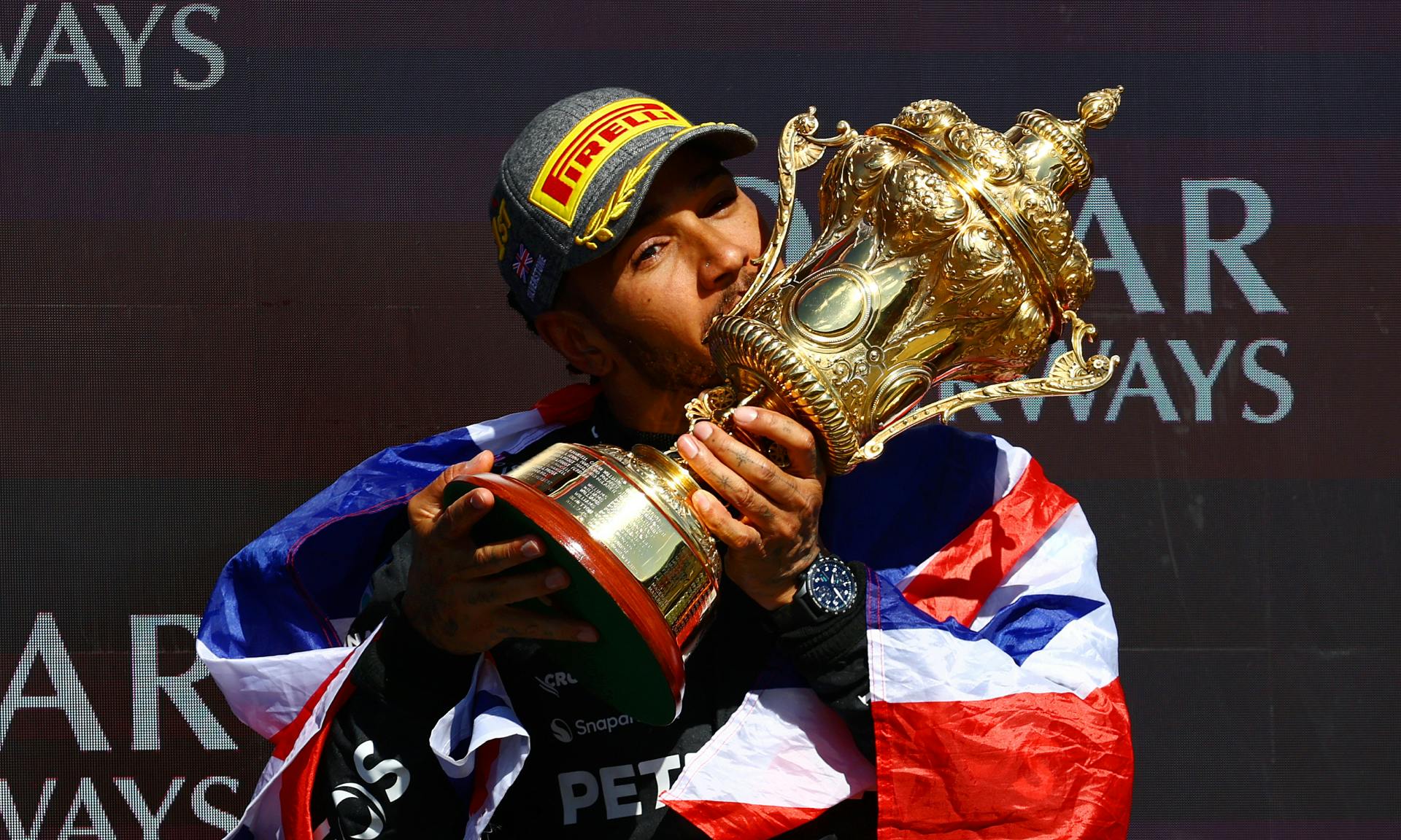  Race winner Lewis Hamilton of Great Britain and Mercedes celebrates on the podium during the F1 Grand Prix of Great Britain at Silverstone Circuit on July 07, 2024