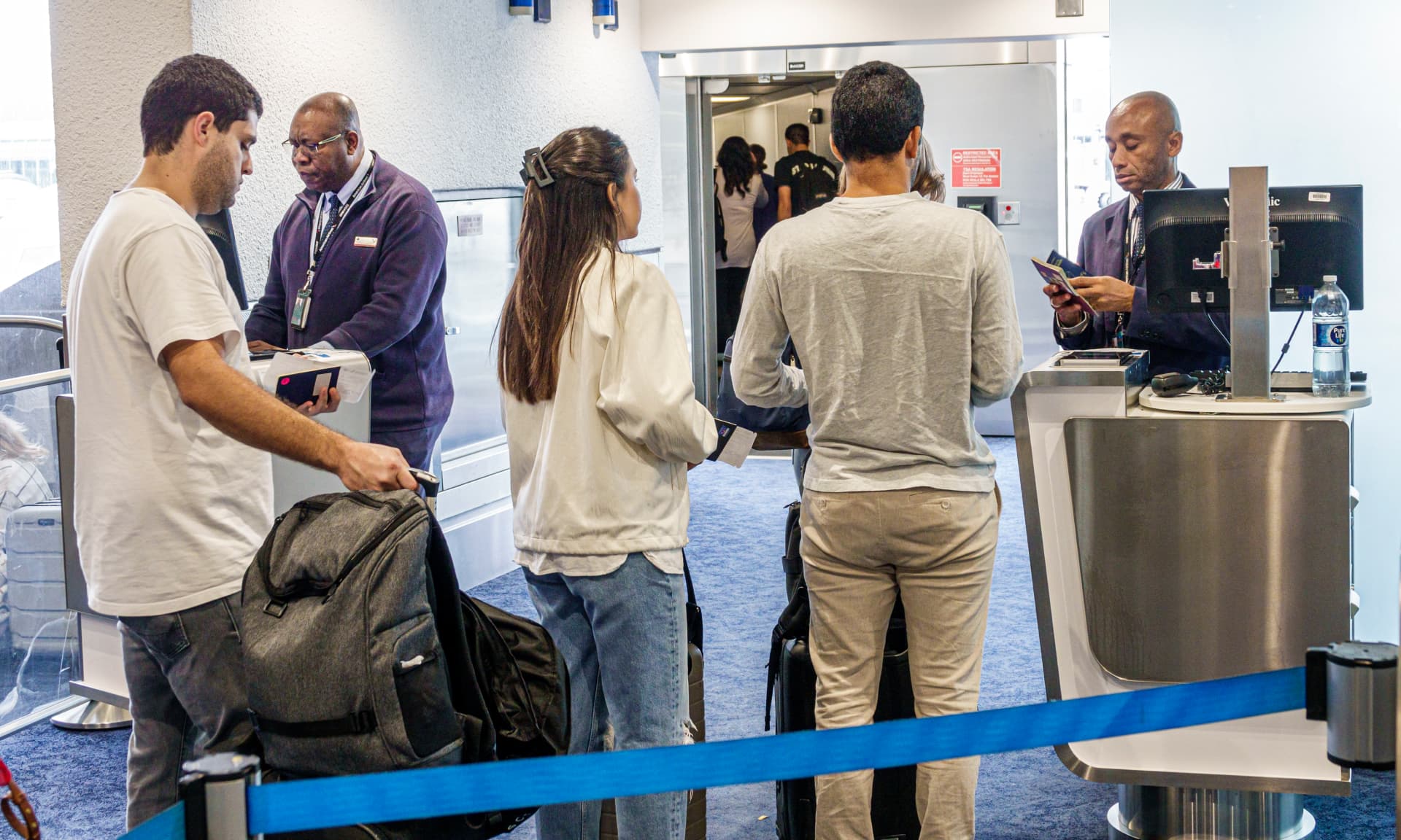 People in line at the airport gate