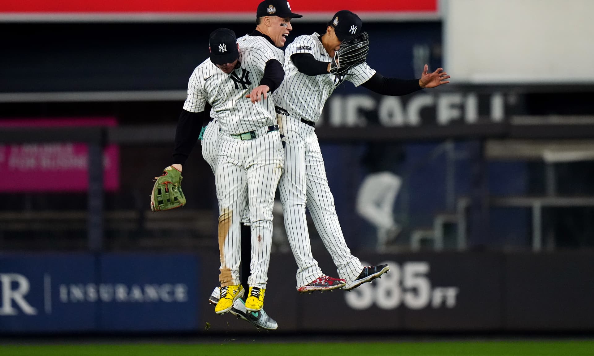 Alex Verdugo #24, Aaron Judge #99 and Juan Soto #22 of the New York Yankees celebrate after the Yankees defeated the Los Angeles Dodgers in Game 4 of the 2024 World Series