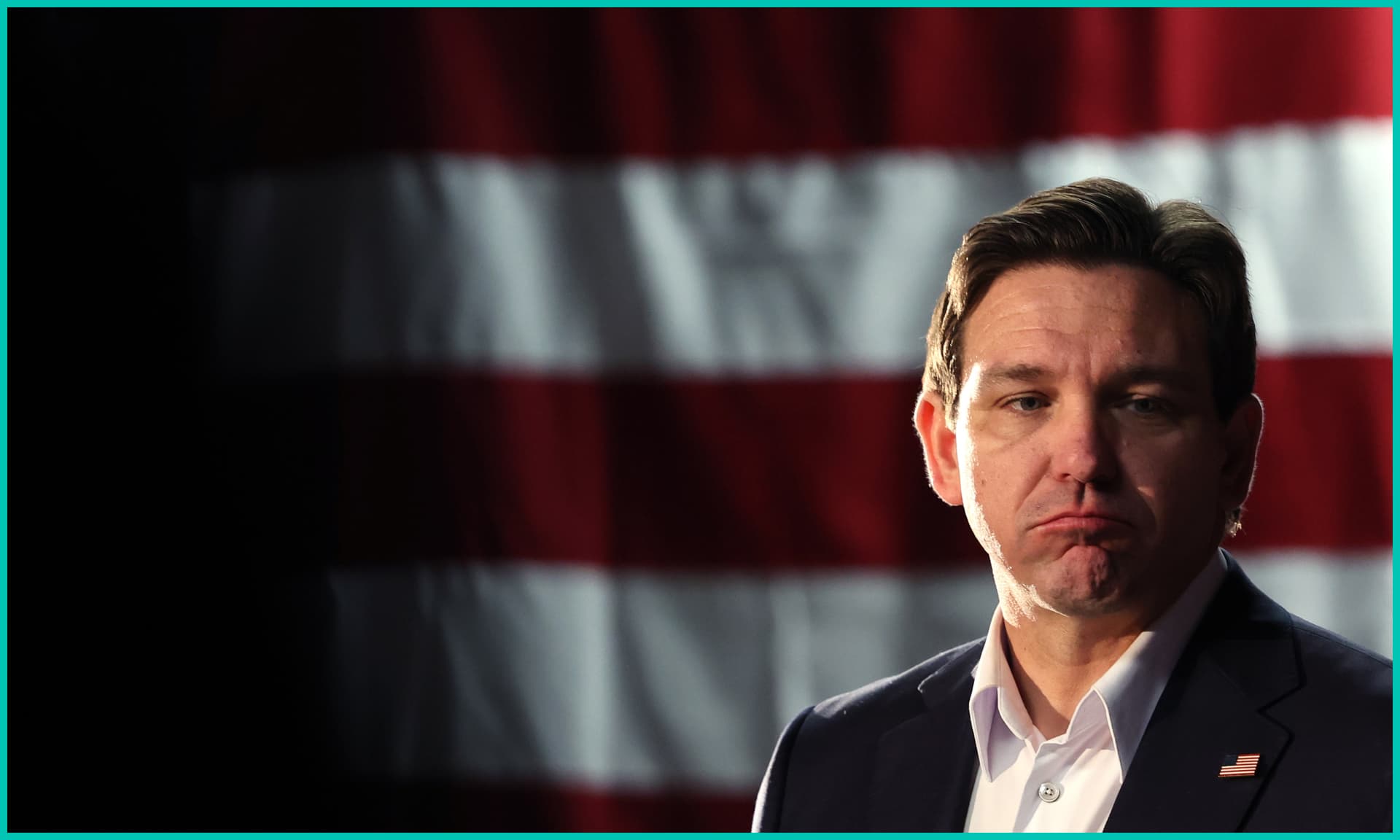 Republican presidential candidate Florida Gov. Ron DeSantis looks on during a campaign event at The Grass Wagon