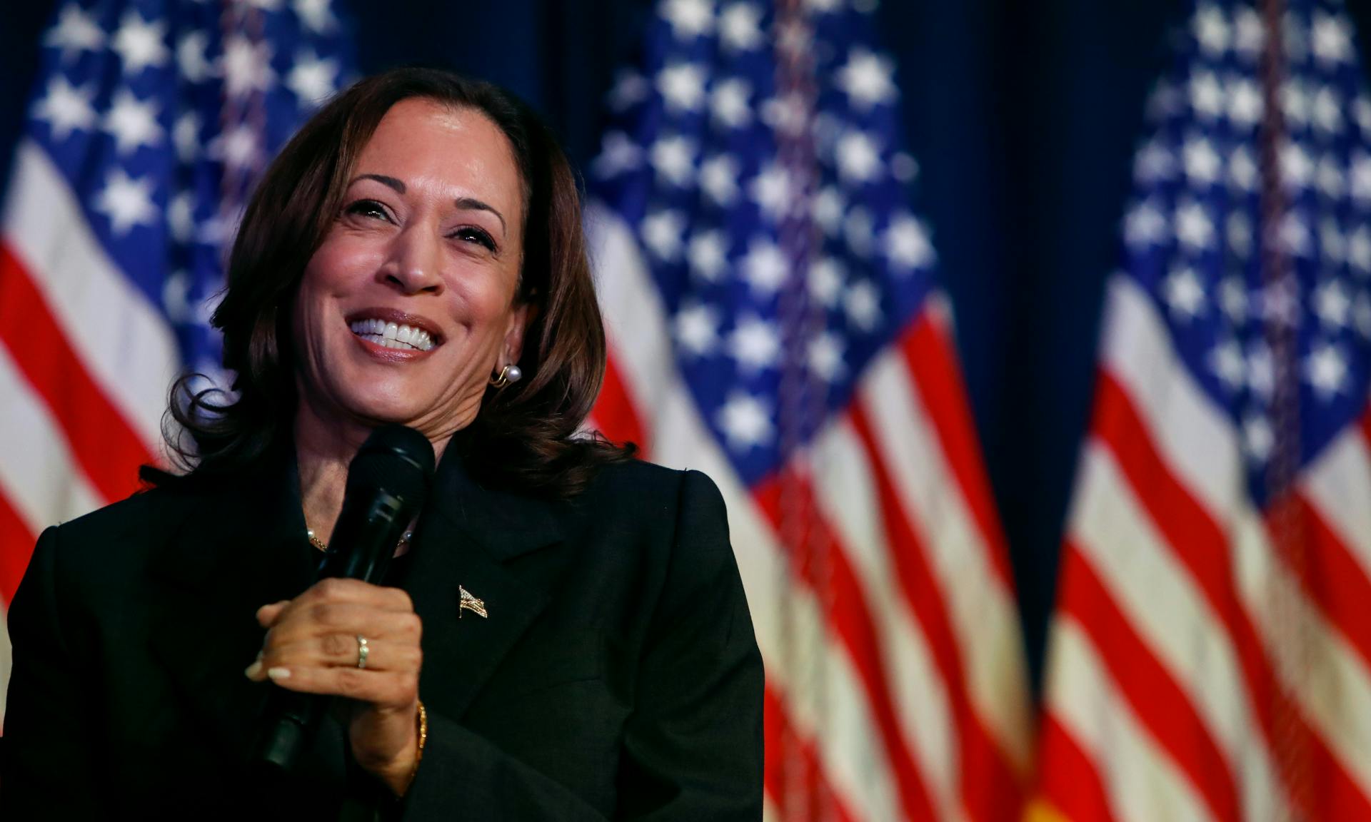  US Vice President Kamala Harris speaks at a moderated conversation with former Trump administration national security official Olivia Troye and former Republican voter Amanda Stratton on July 17, 2024 in Kalamazoo, Michigan.