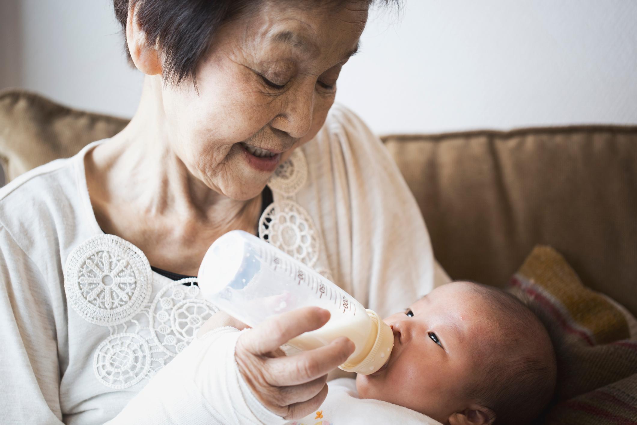 grandma feeding grandson