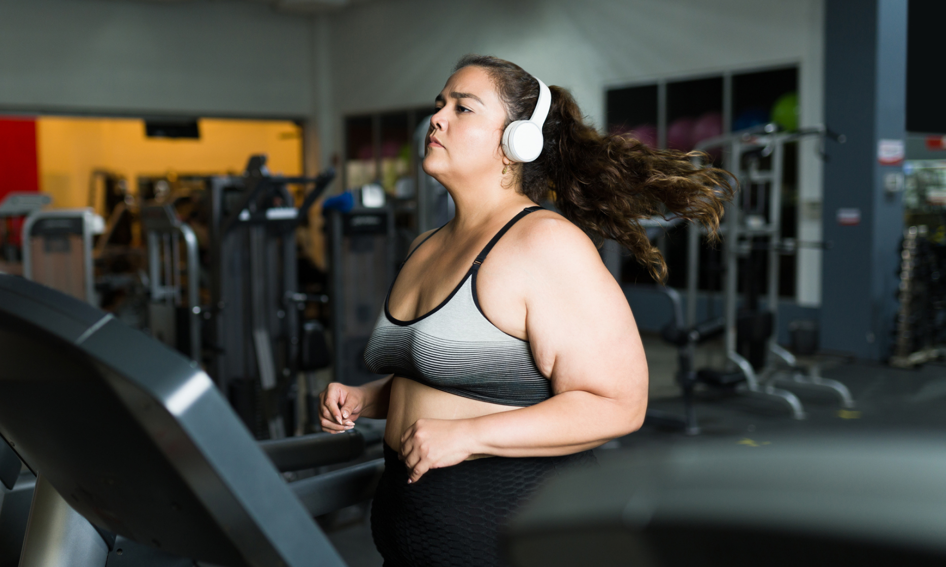 A woman running on a treadmill