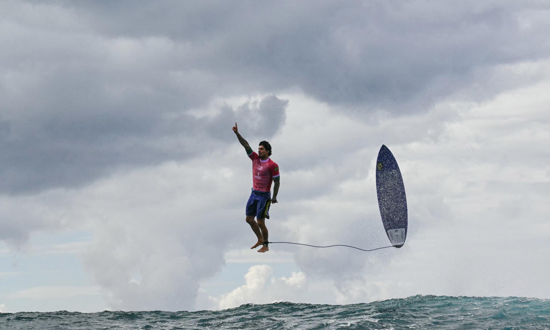 Brazil's Gabriel Medina reacts after getting a large wave in the 5th heat of the men's surfing round 3, during the Paris 2024 Olympic Games, in Teahupo'o