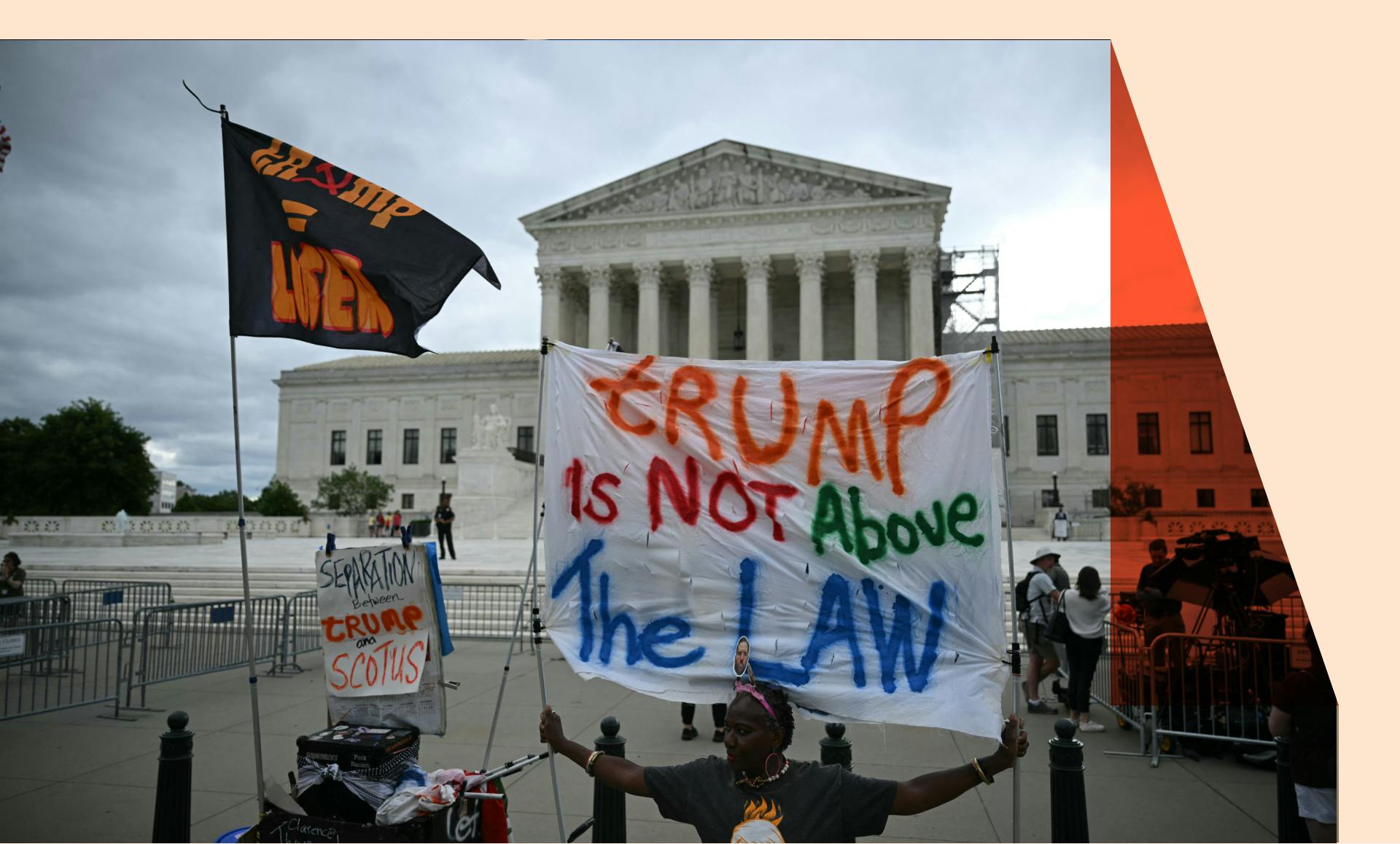 People hold anti Trump signs in front of the US Supreme Court on July 1, 2024, in Washington, DC.
