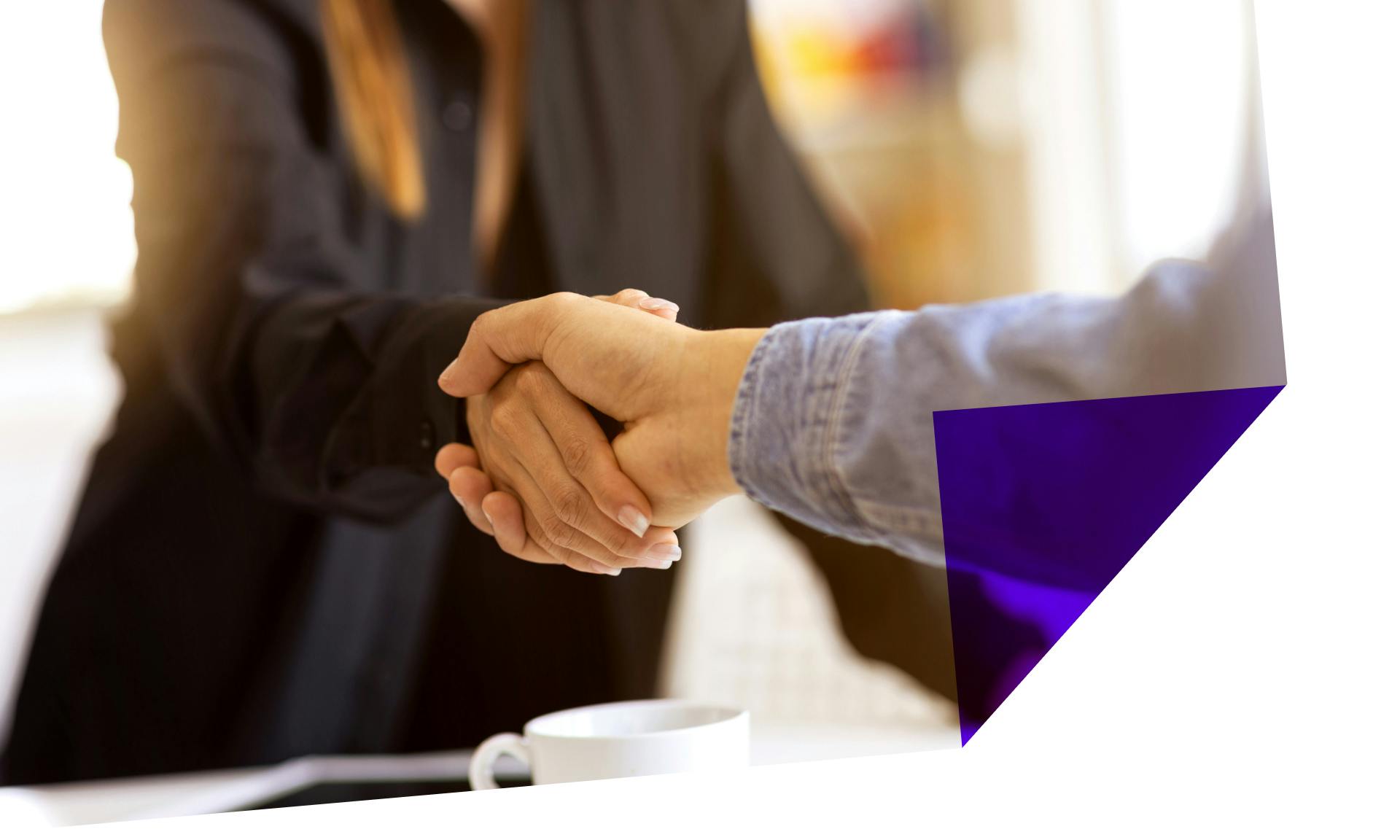 woman shaking hands at job interview