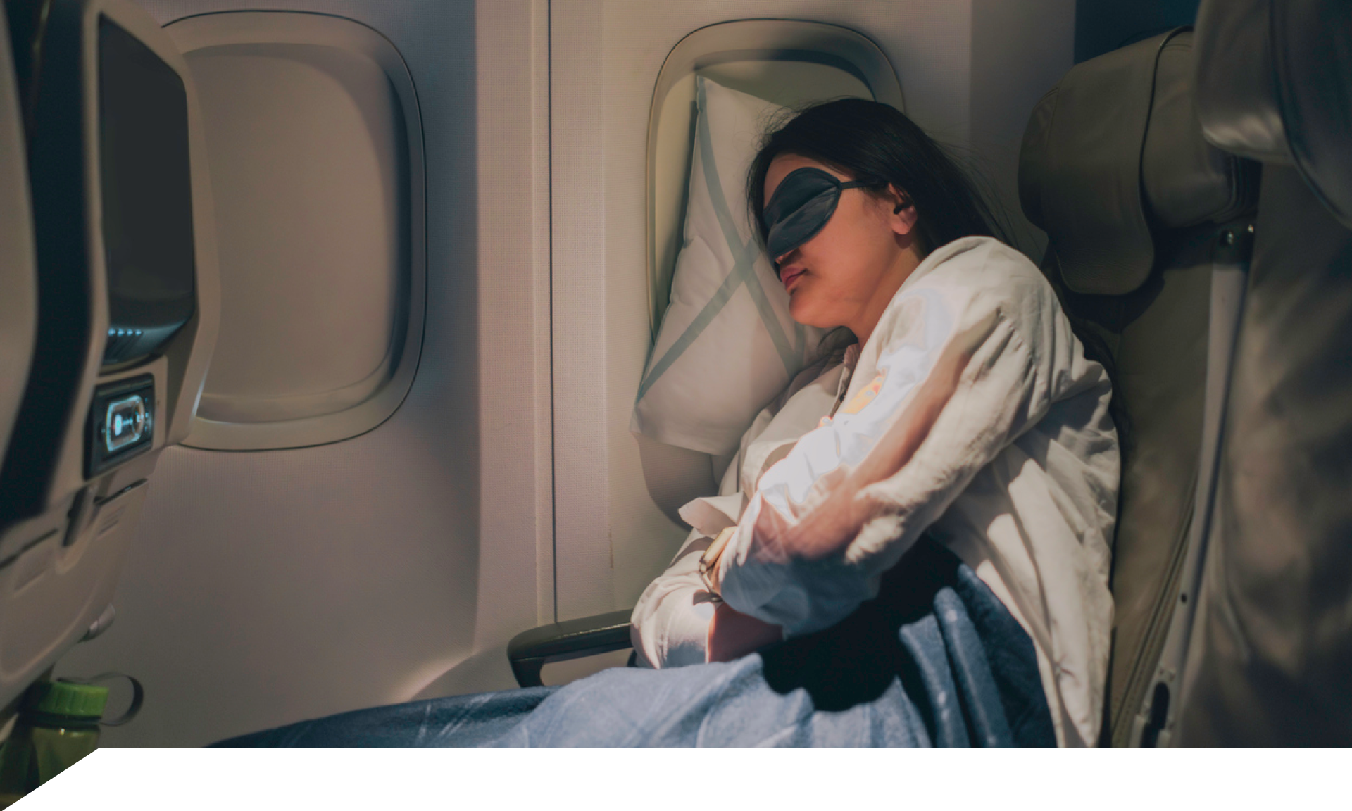 Woman sleeping on an airplane