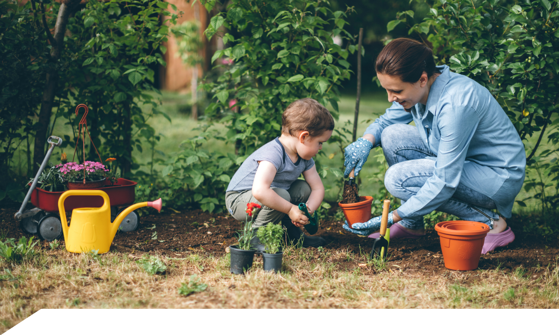 A woman and her son gardening 