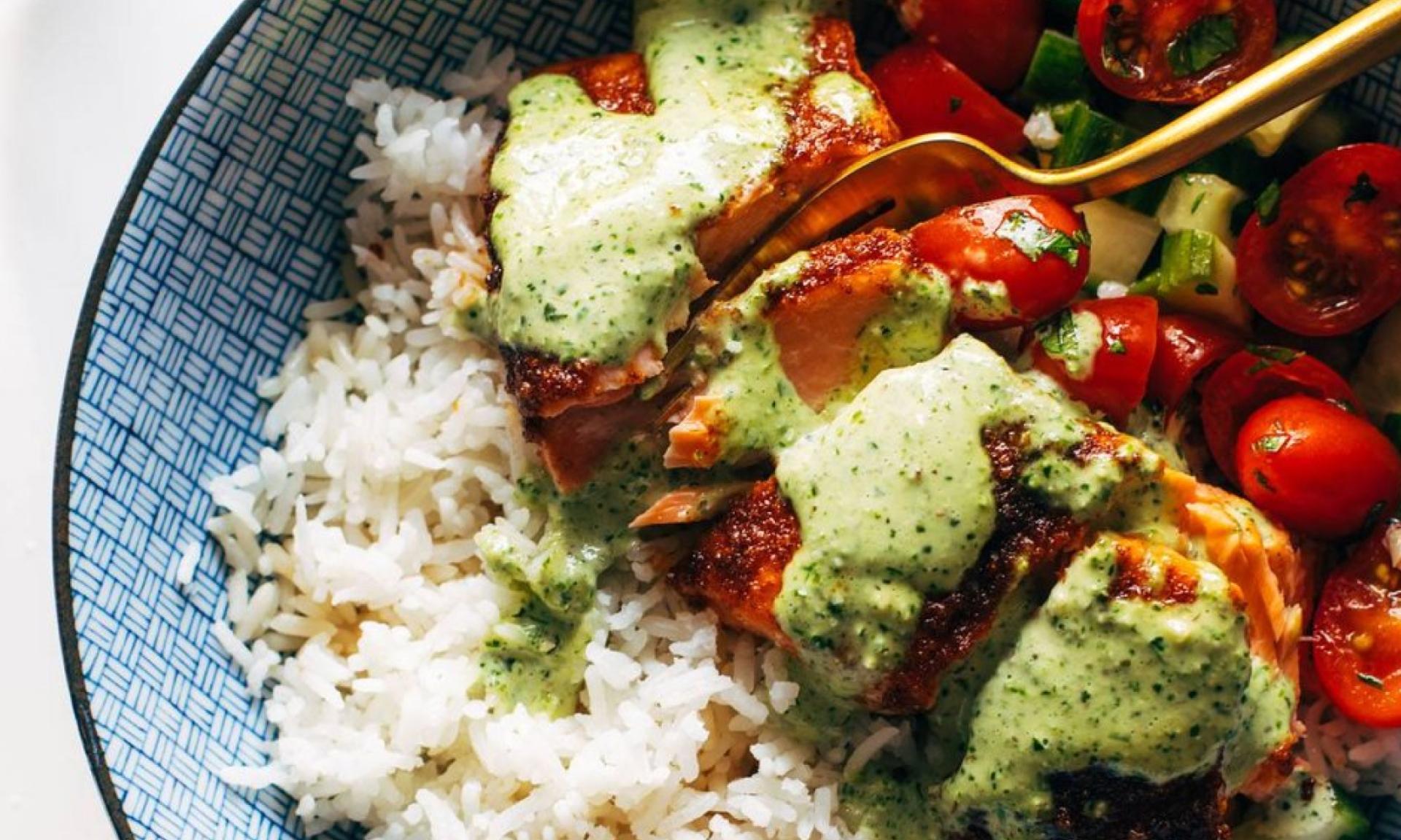 Salmon with basil sauce and tomato salad