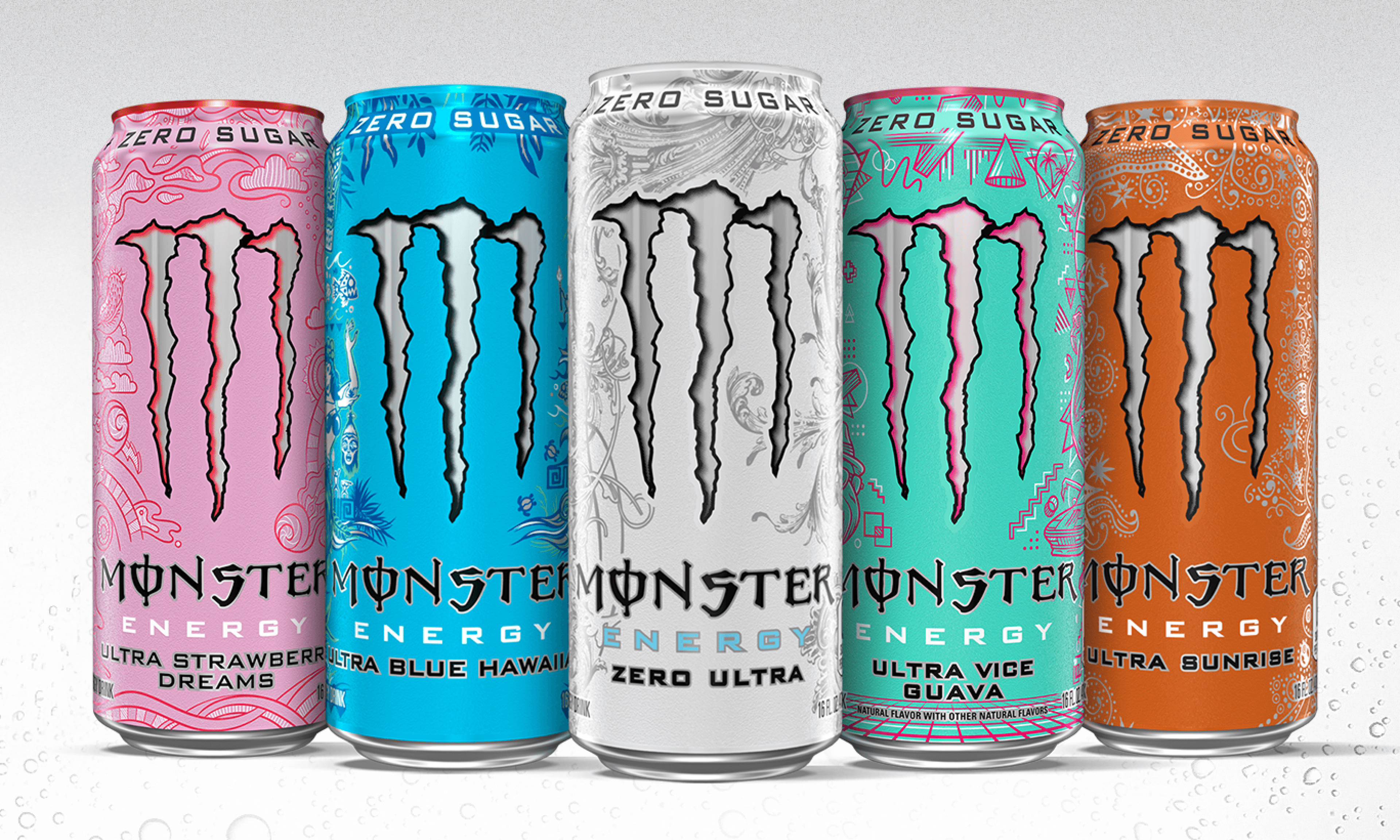 three monster energy drinks