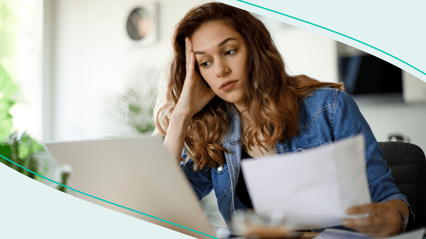 woman holding statement with anxious look stock image