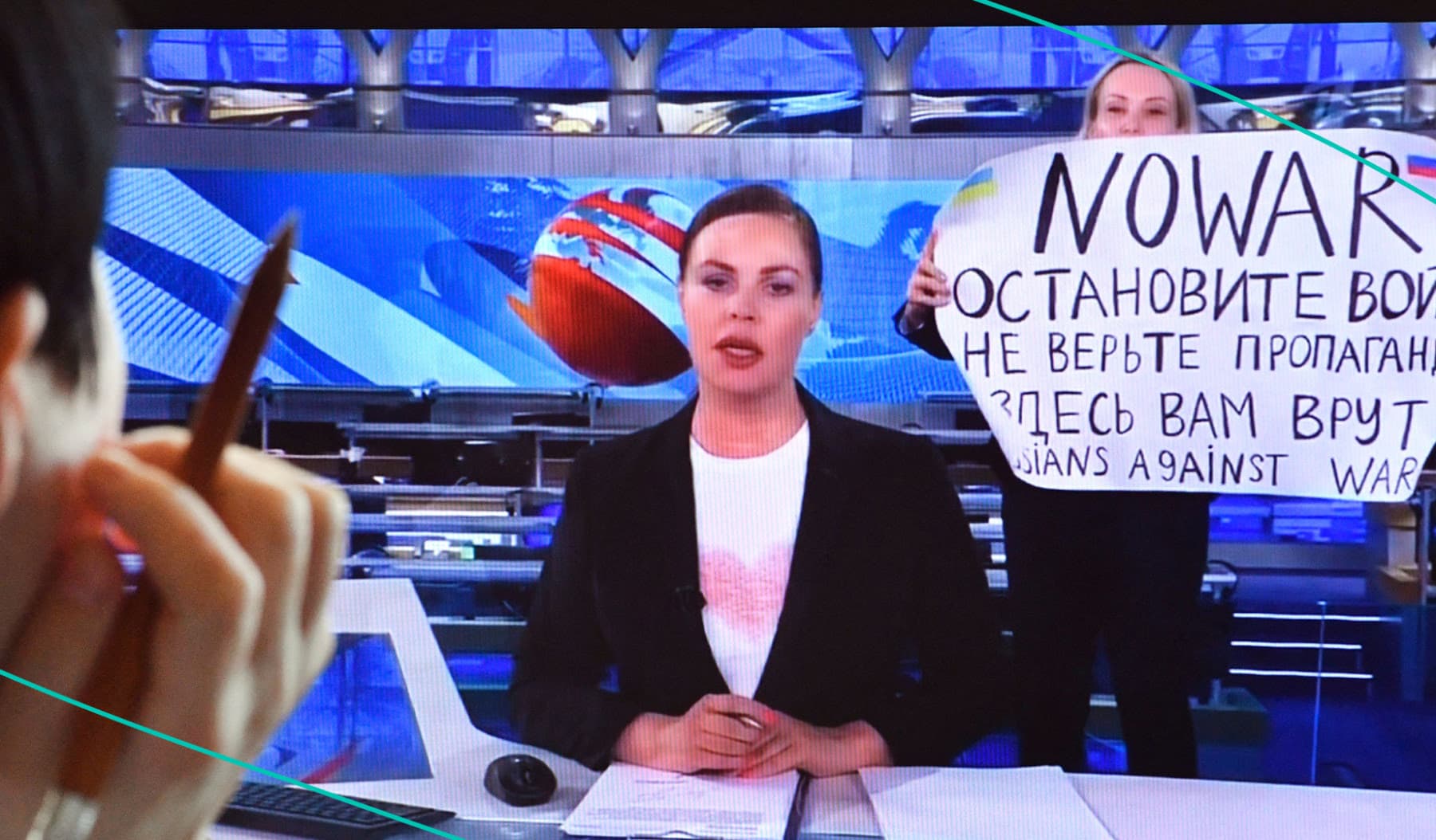 Russian journalist Marina Ovsyannikova holds an anti-war protest on live Russian-state TV