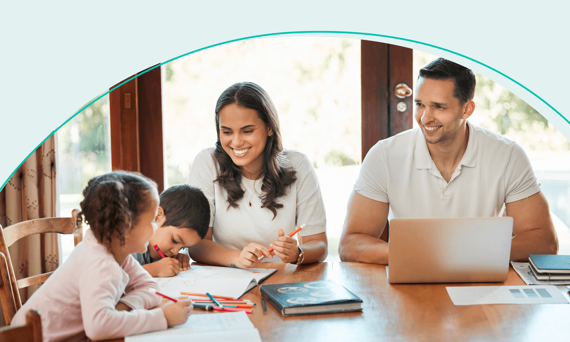 parents with two young kids sitting together at table