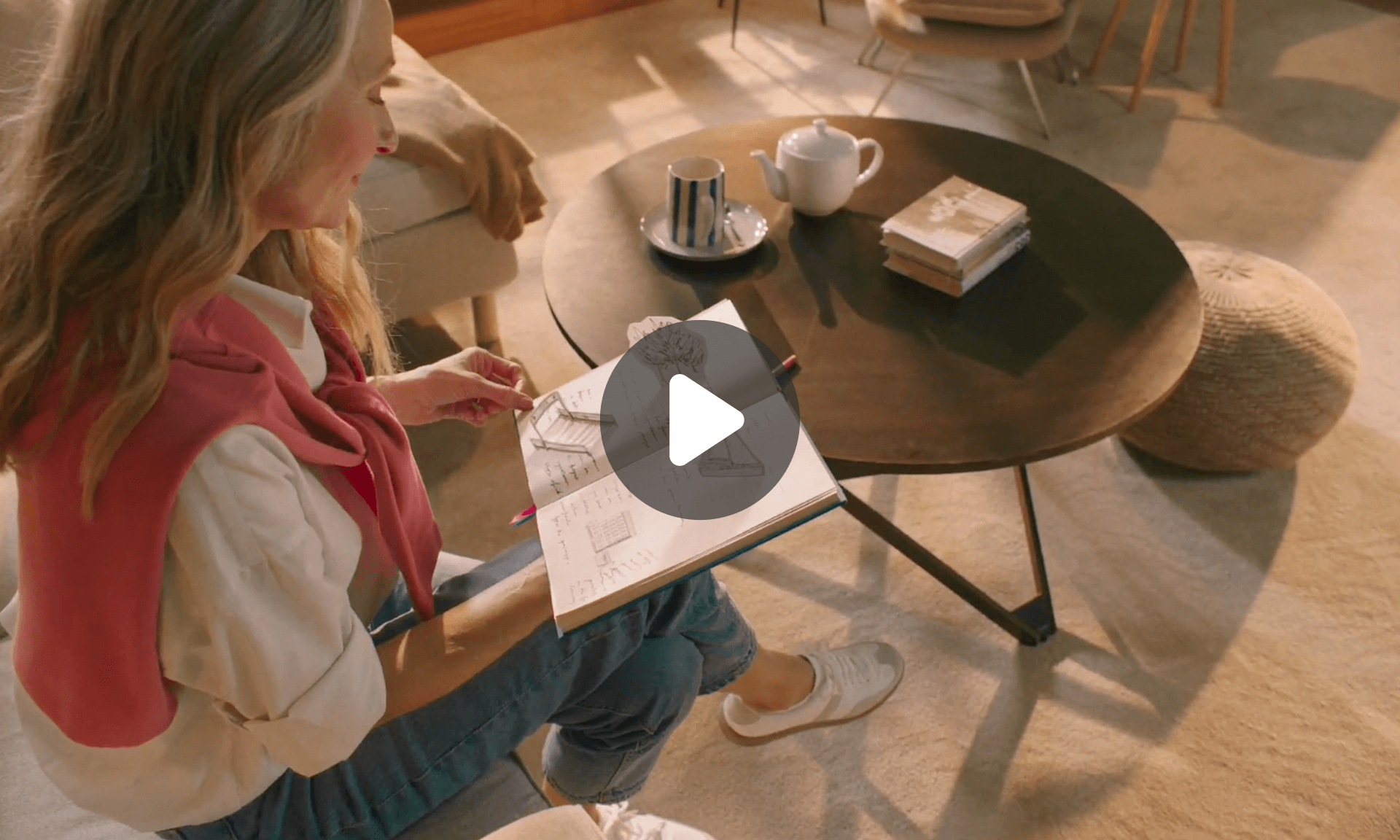 woman at table reading