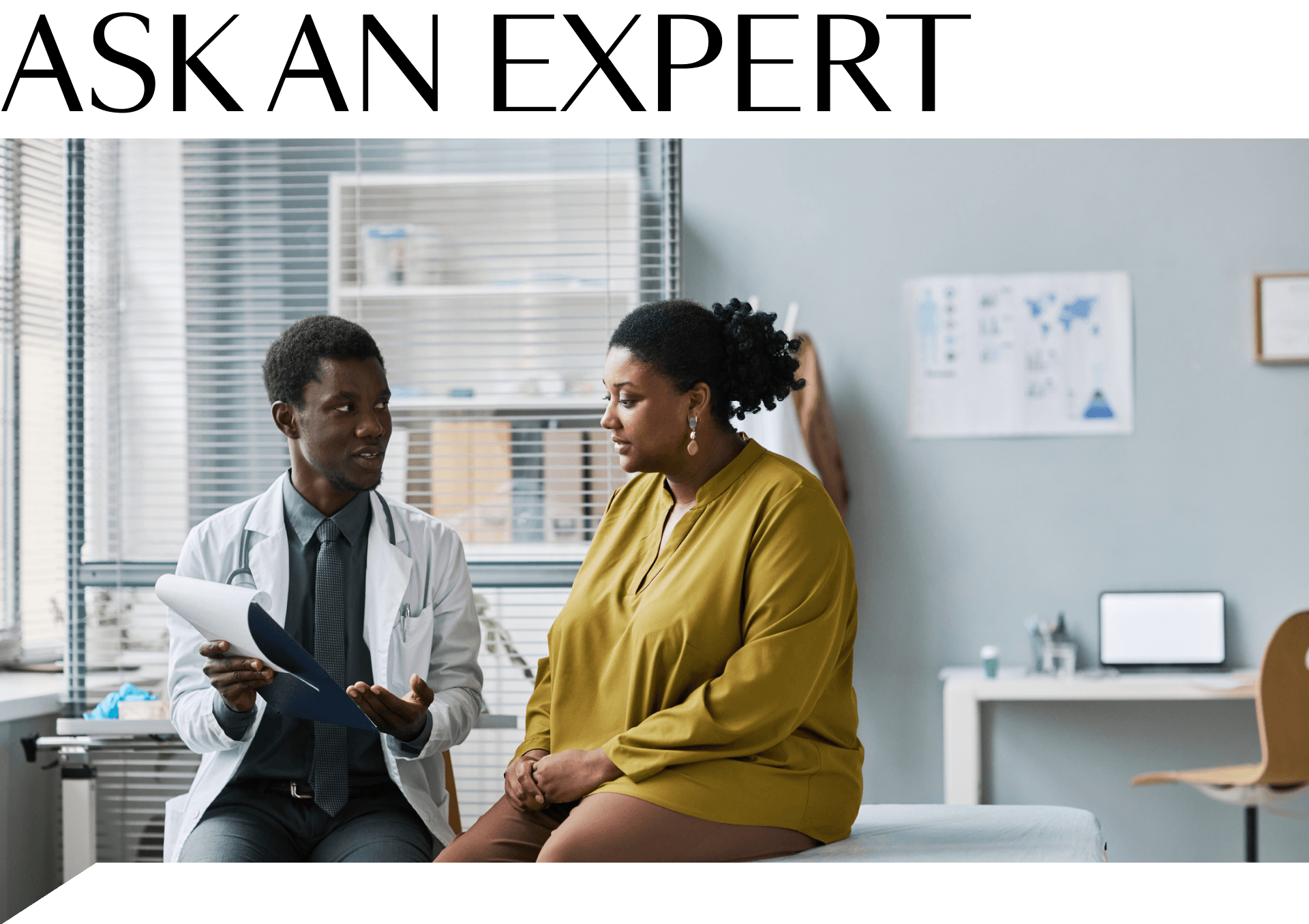 A woman sitting on a table in a doctor's office talking to her doctor
