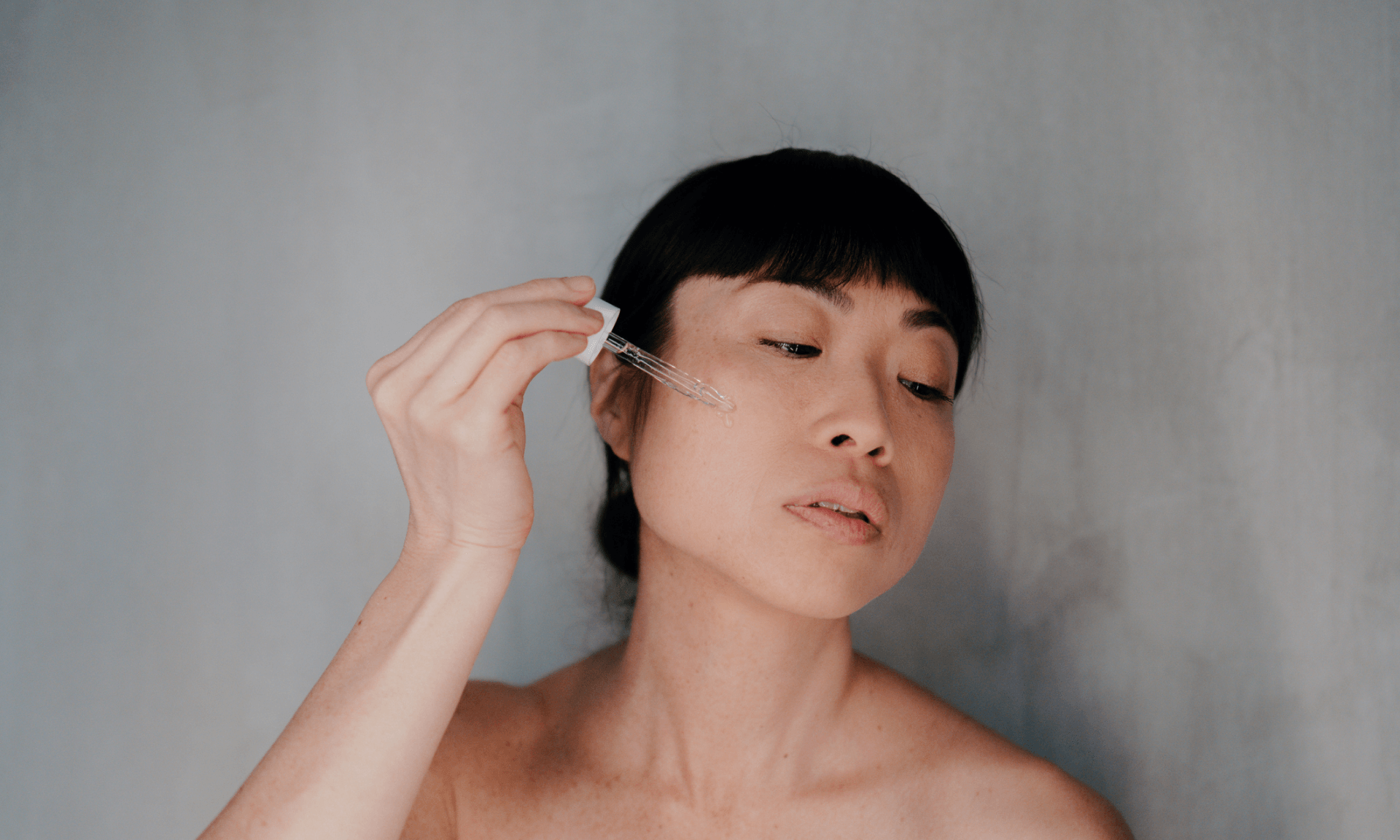 woman holding serum