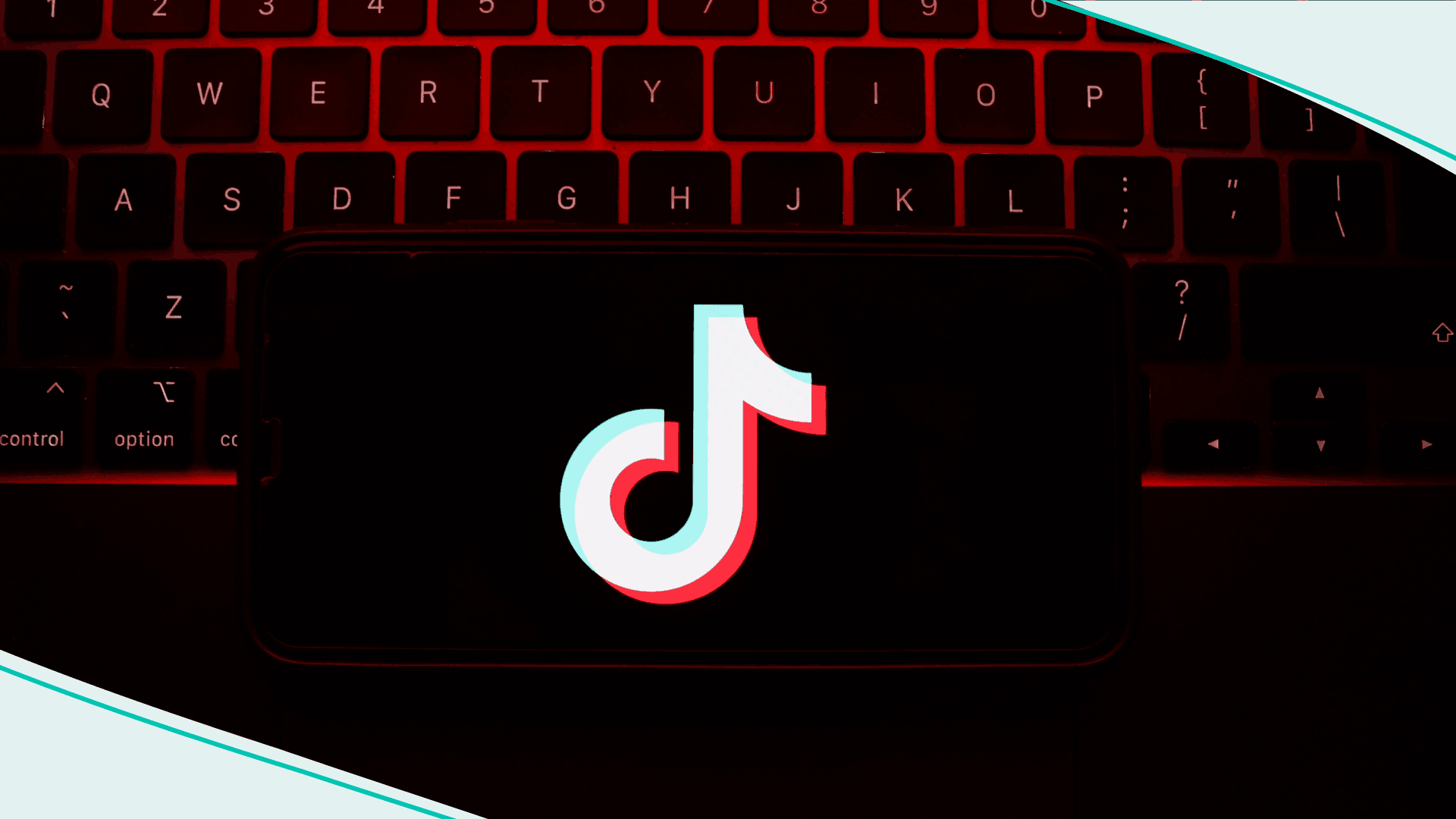 A laptop keyboard and TikTok logo displayed on a phone screen are seen in this illustration photo taken in Krakow, Poland on May 7, 2023