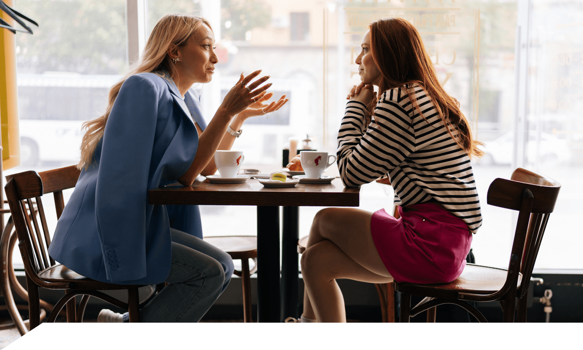 Two women at a coffee stop chatting