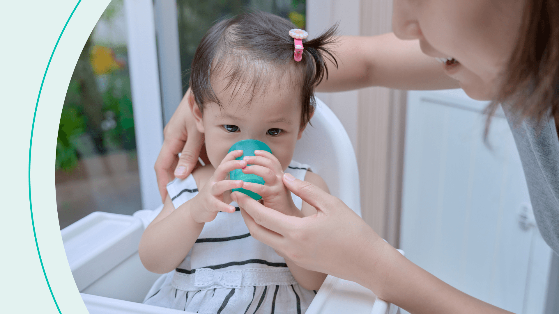 baby drinking from cup