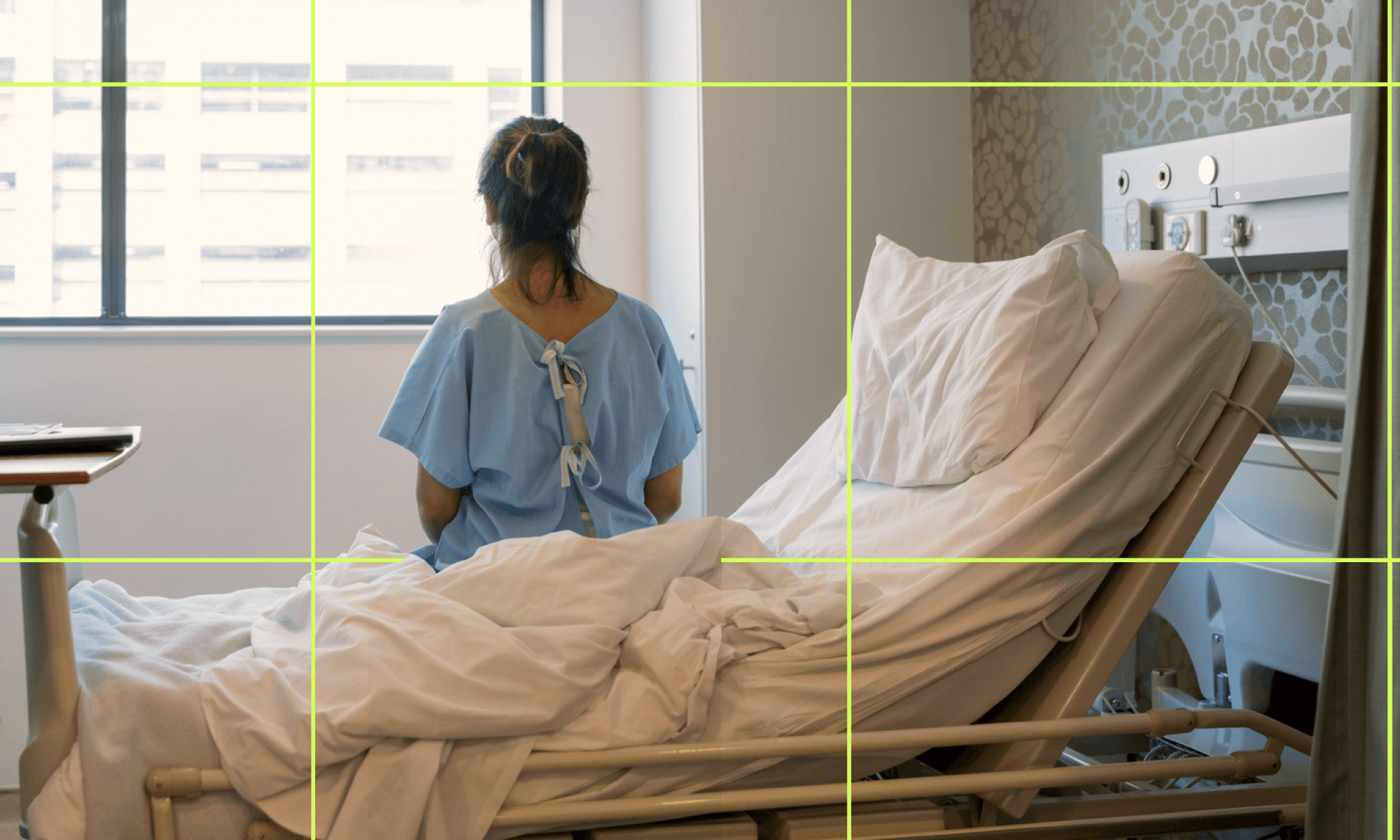 woman sitting in hospital bed