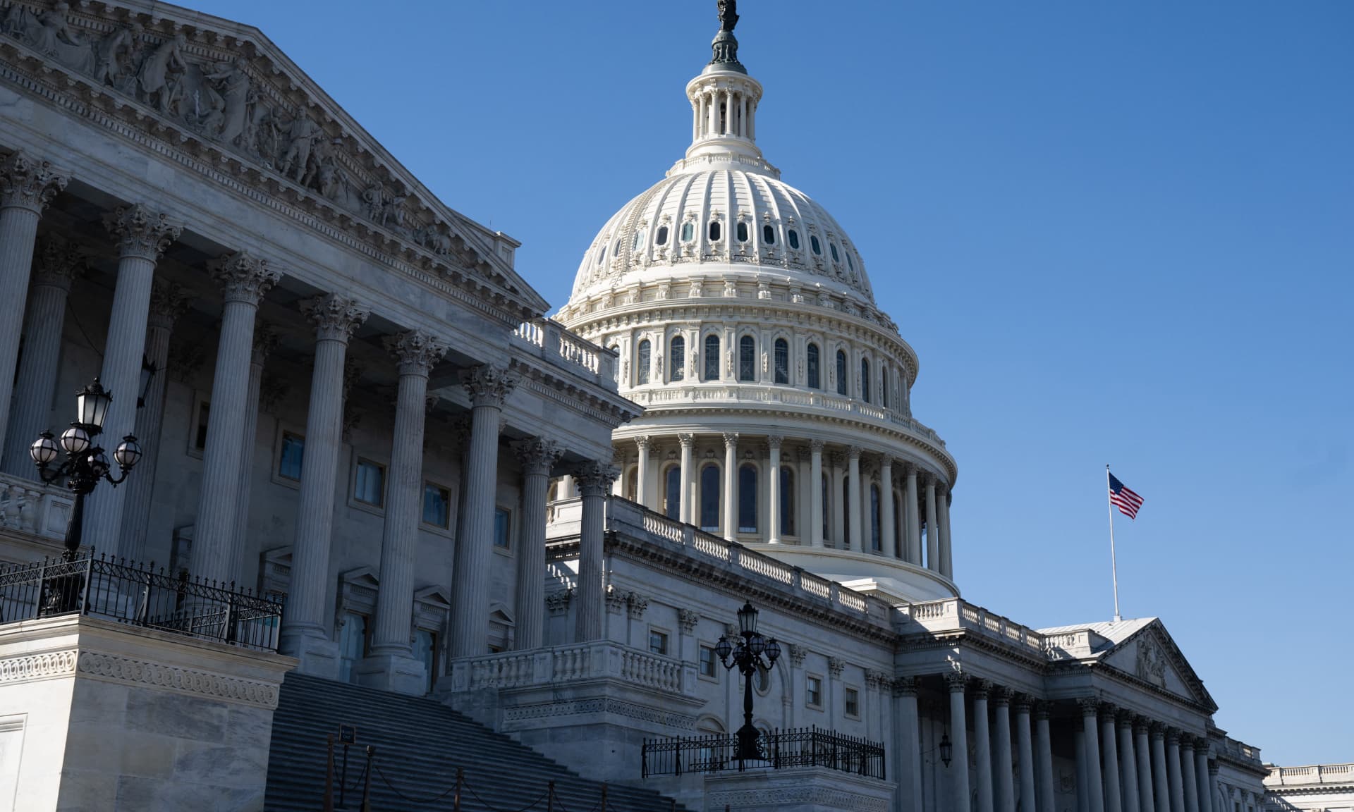 US flag flies near the dome of the US Capitol in Washington, DC, February 25, 2025.