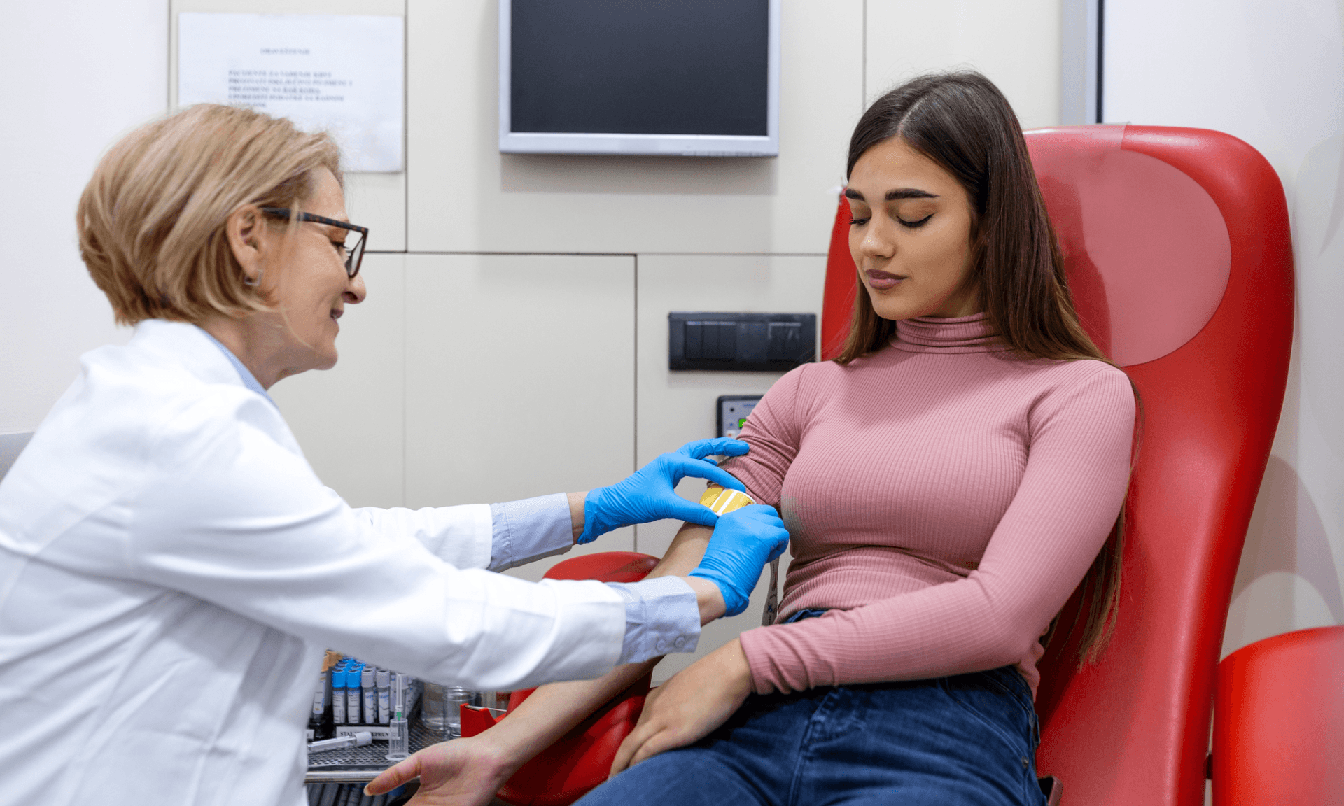 A doctor administering a blood test