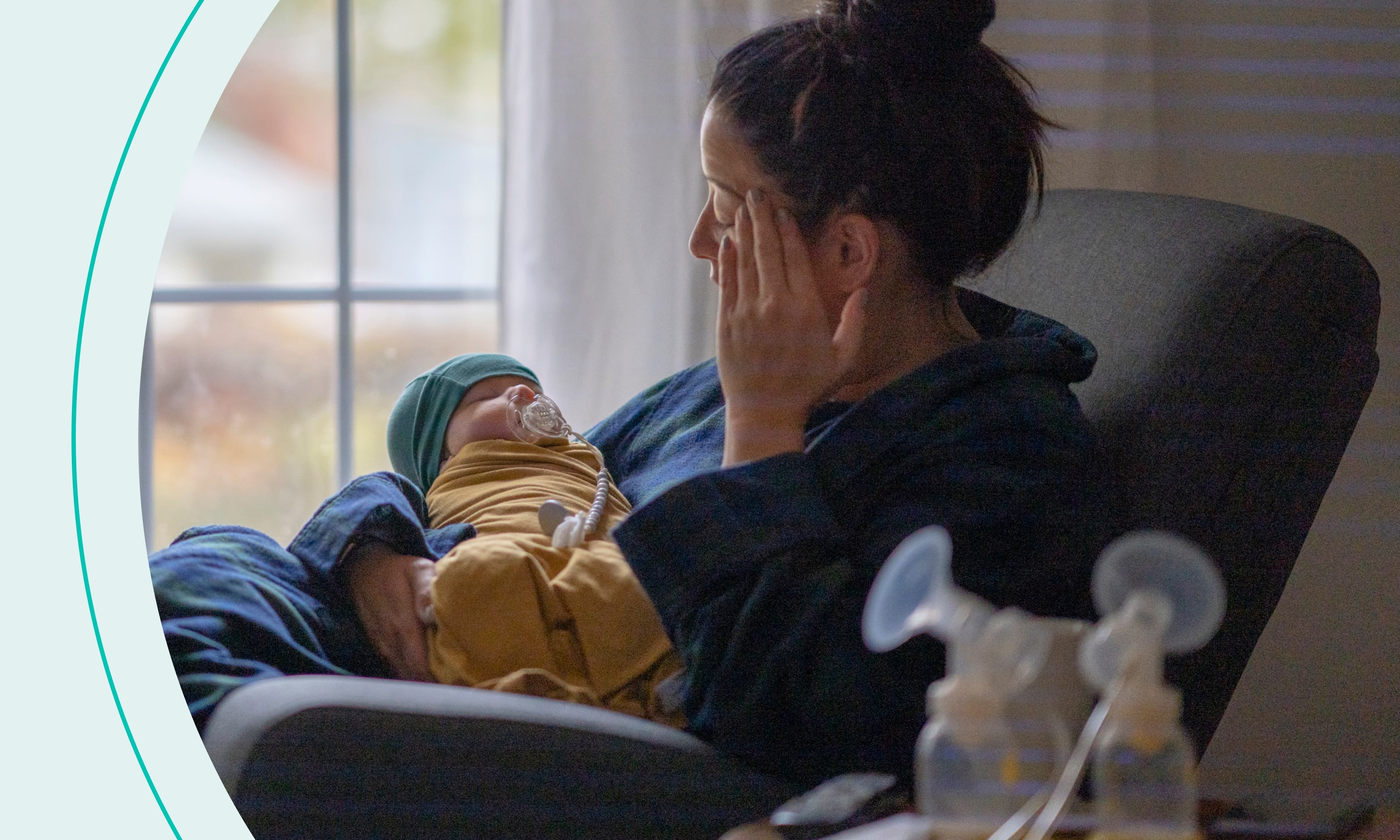 tired mom holds her newborn