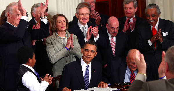 President Obama signs the Affordable Care Act into law
